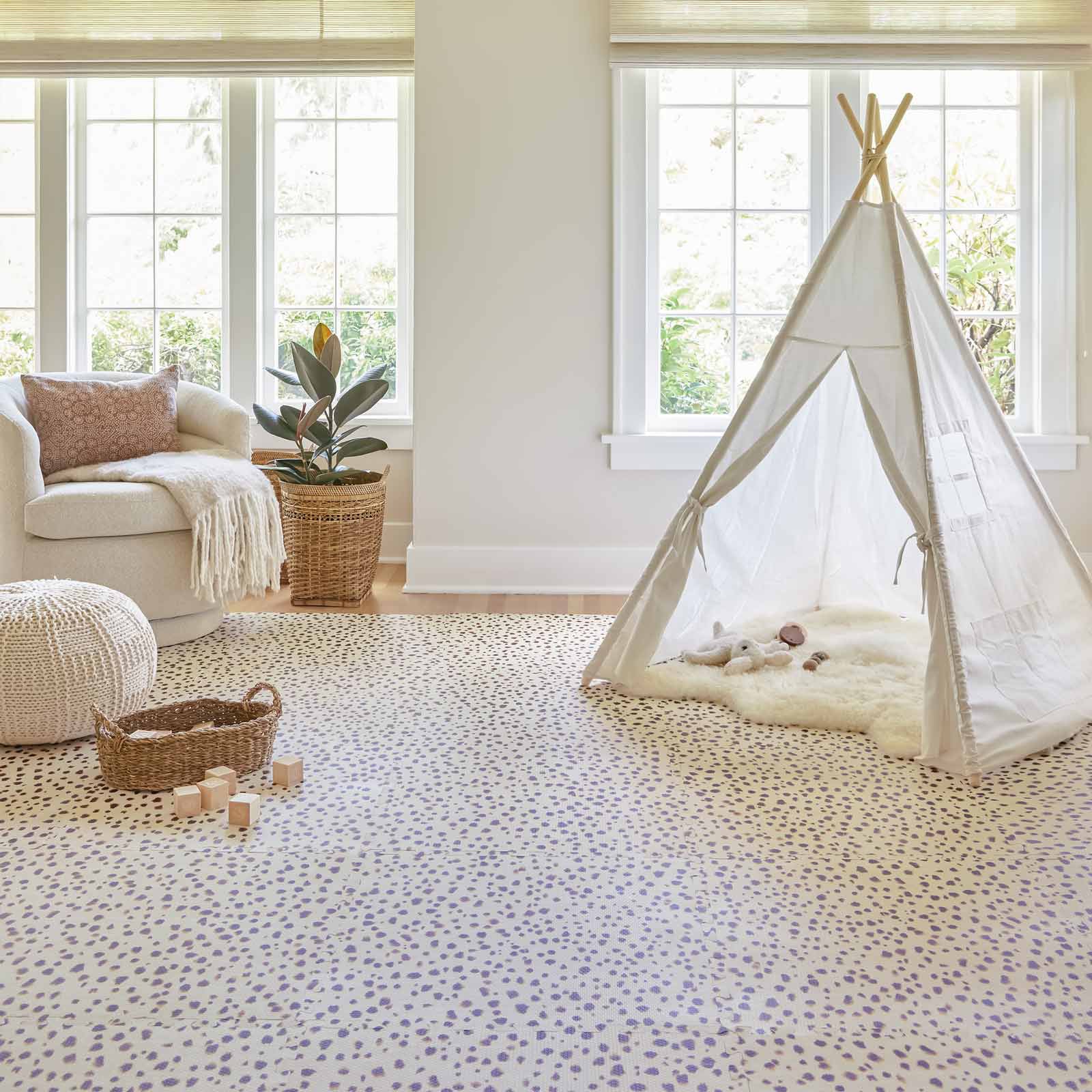 Bobbi Umber brown and beige polka dot little nomad play mat shown in living room with play tent and basket of blocks