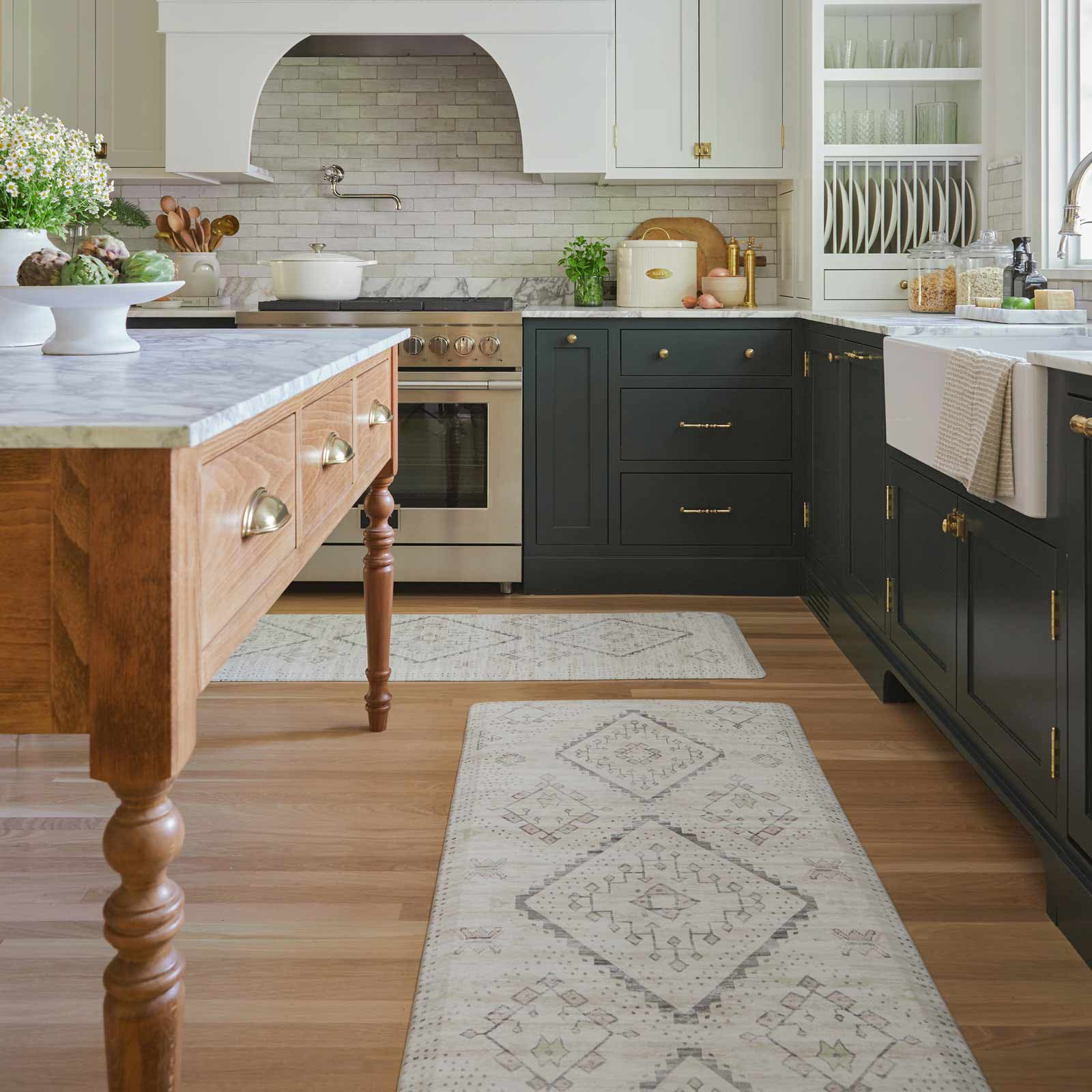 Ula Calico neutral boho print standing mat shown in a kitchen in sizes 30x72 and 22x72 in front of the counters and island